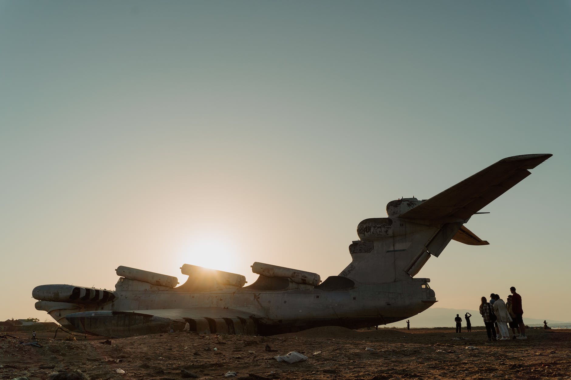 photo of an abandoned ekranoplan during sunset